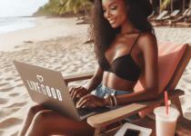 LiveGood affiliate on the beach working on her computer
